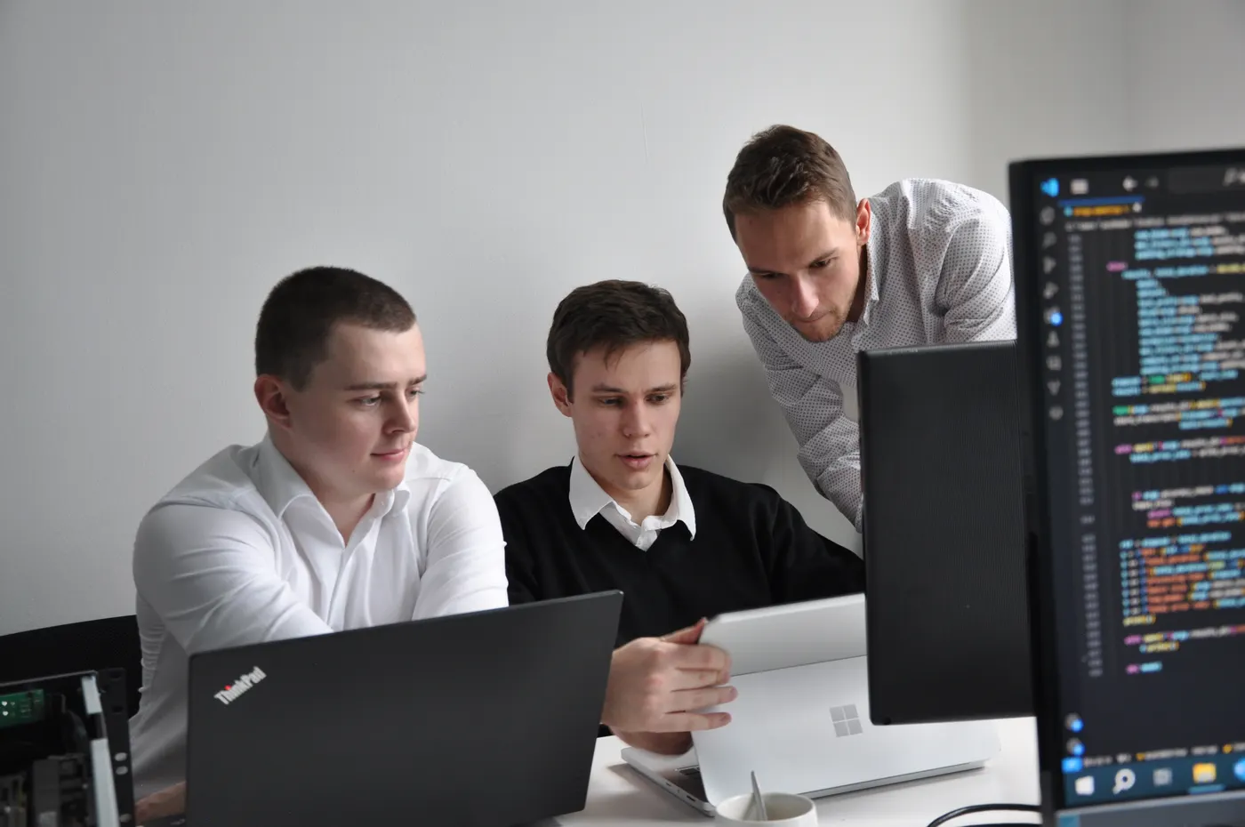 Ollsoft engineers reviewing code together
